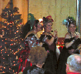Delano Dollies singing in front of the Christmas tree