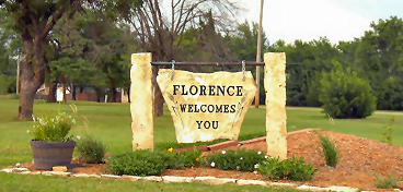 Stone Florence sign with plantings